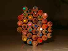 icon grid systems shown as colored pencils lined up on a desk
